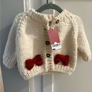 Cozy Cream Cardigan with Red Bow Accents